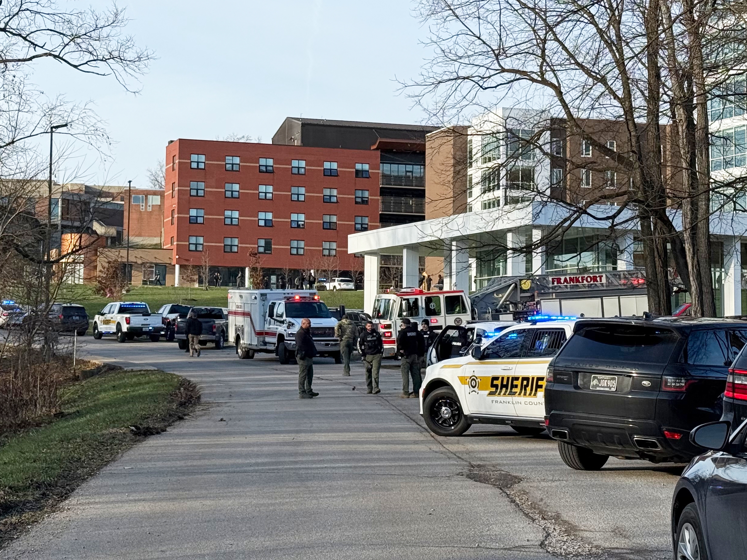 caption: Law enforcement responds to a shooting at Whitney Moore Young Jr. Hall on Kentucky State University's campus in Frankfort, Ky., on Tuesday.