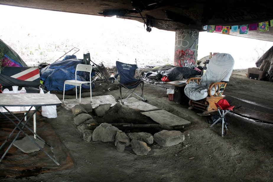 caption: A camp area at the caves in the north part of the Jungle, Seattle's notorious homeless encampment that leapt onto the map after a fatal shooting in January.