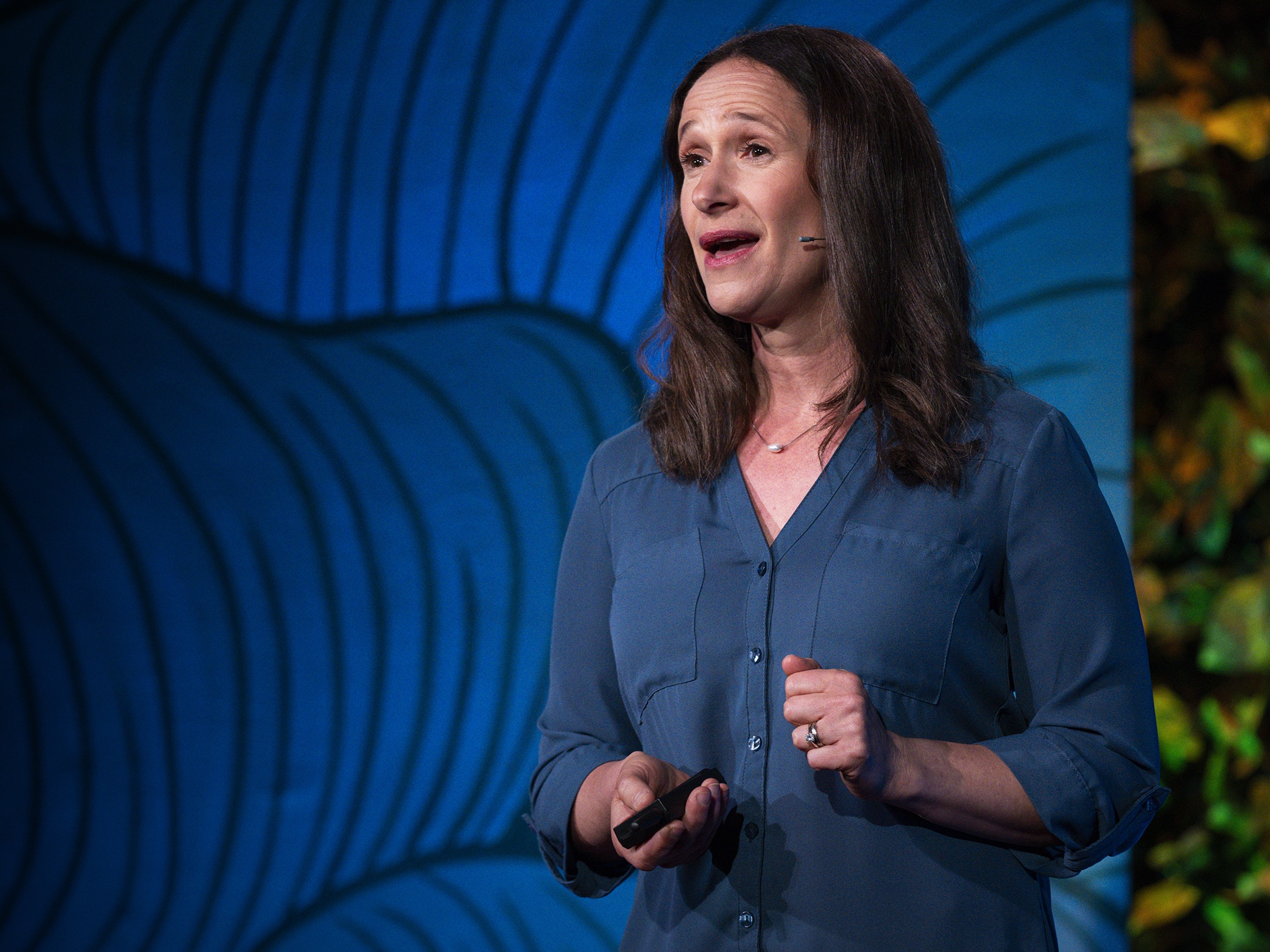 caption: Dana Gunders speaking at TED 2024