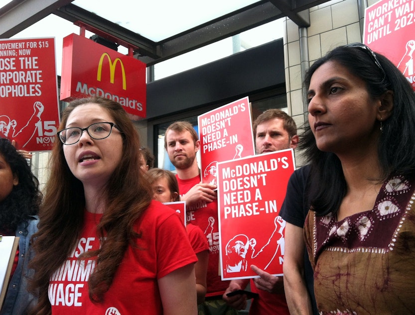caption: Jess Spear of the 15 Now campaign and Seattle City Council member Kshama Sawant outside the downtown Seattle McDonald’s.