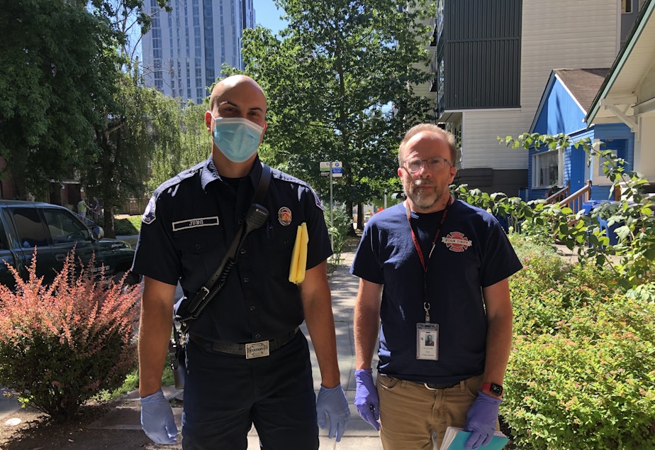 caption: Seattle is updating its 911 dispatch to allow new types of call responses. Firefighter Matthew Jung, left, and caseworker Greg Jensen are members of SFD's existing Health One unit which pursues non-emergency calls. 