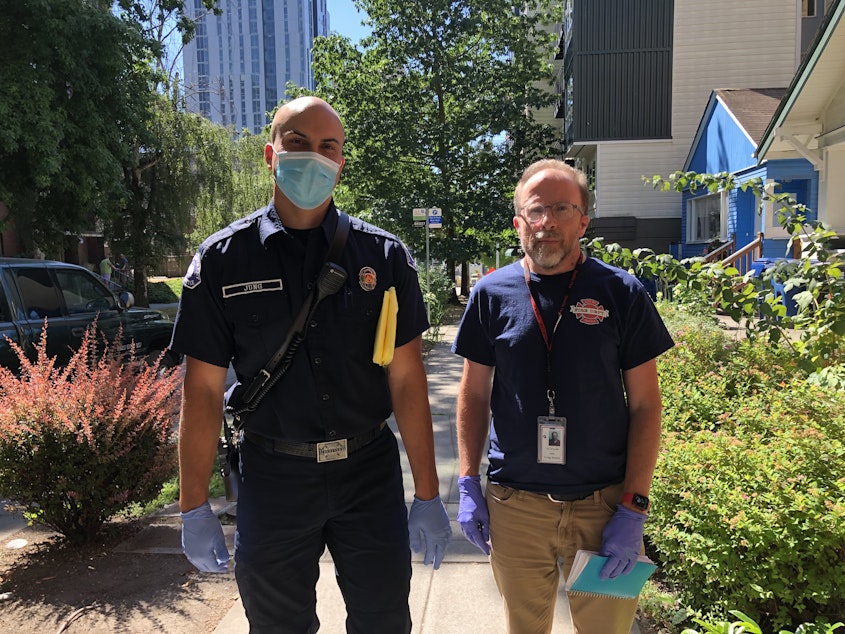 caption: Seattle is updating its 911 dispatch to allow new types of call responses. Firefighter Matthew Jung, left, and caseworker Greg Jensen are members of SFD's existing Health One unit which pursues non-emergency calls. 