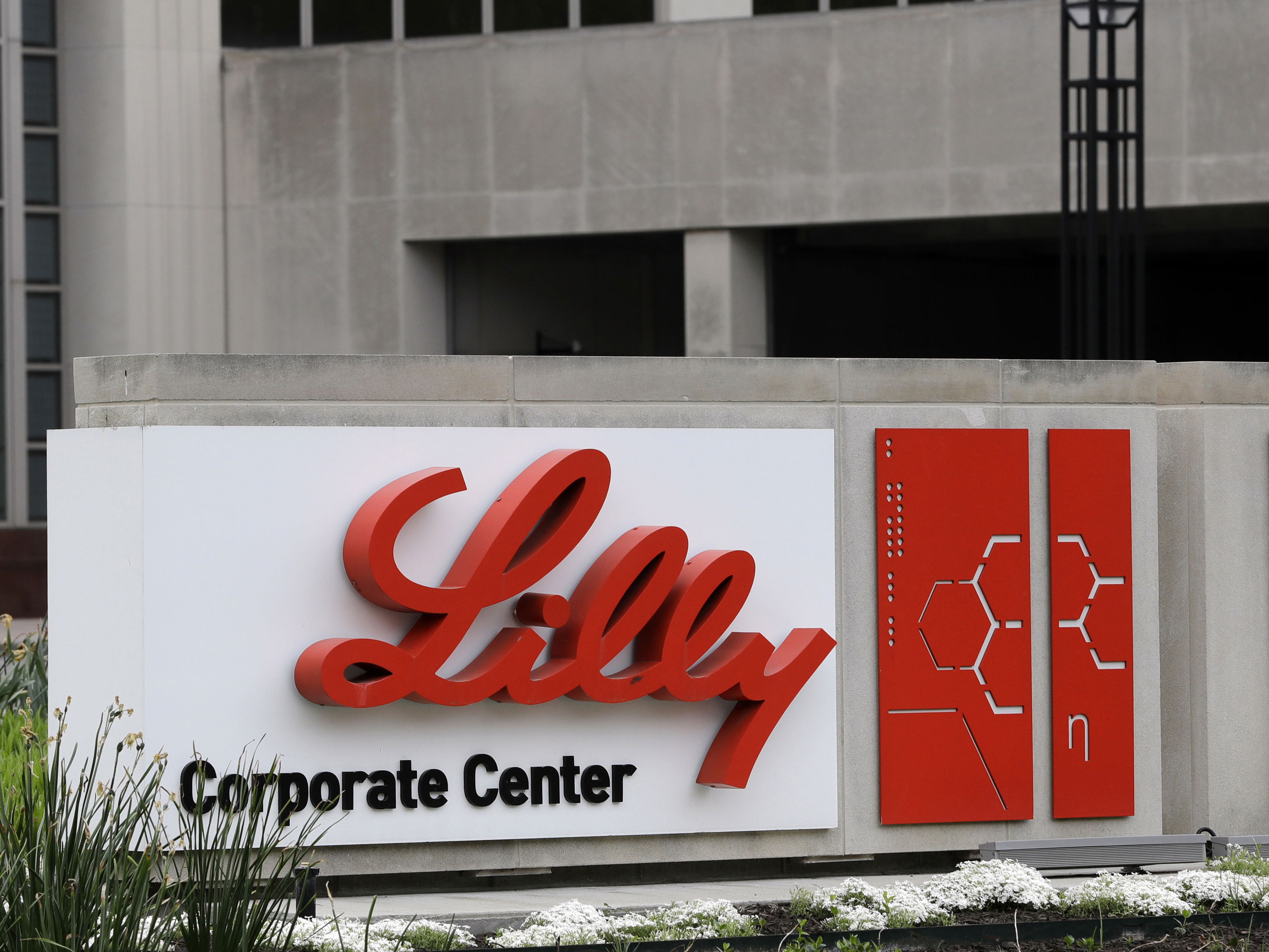 caption: The Eli Lilly & Co. corporate headquarters in Indianapolis. Eli Lilly announced on Wednesday that it will cut prices for some older insulins later this year, and immediately expand a cap on costs insured patients pay when they fill prescriptions.