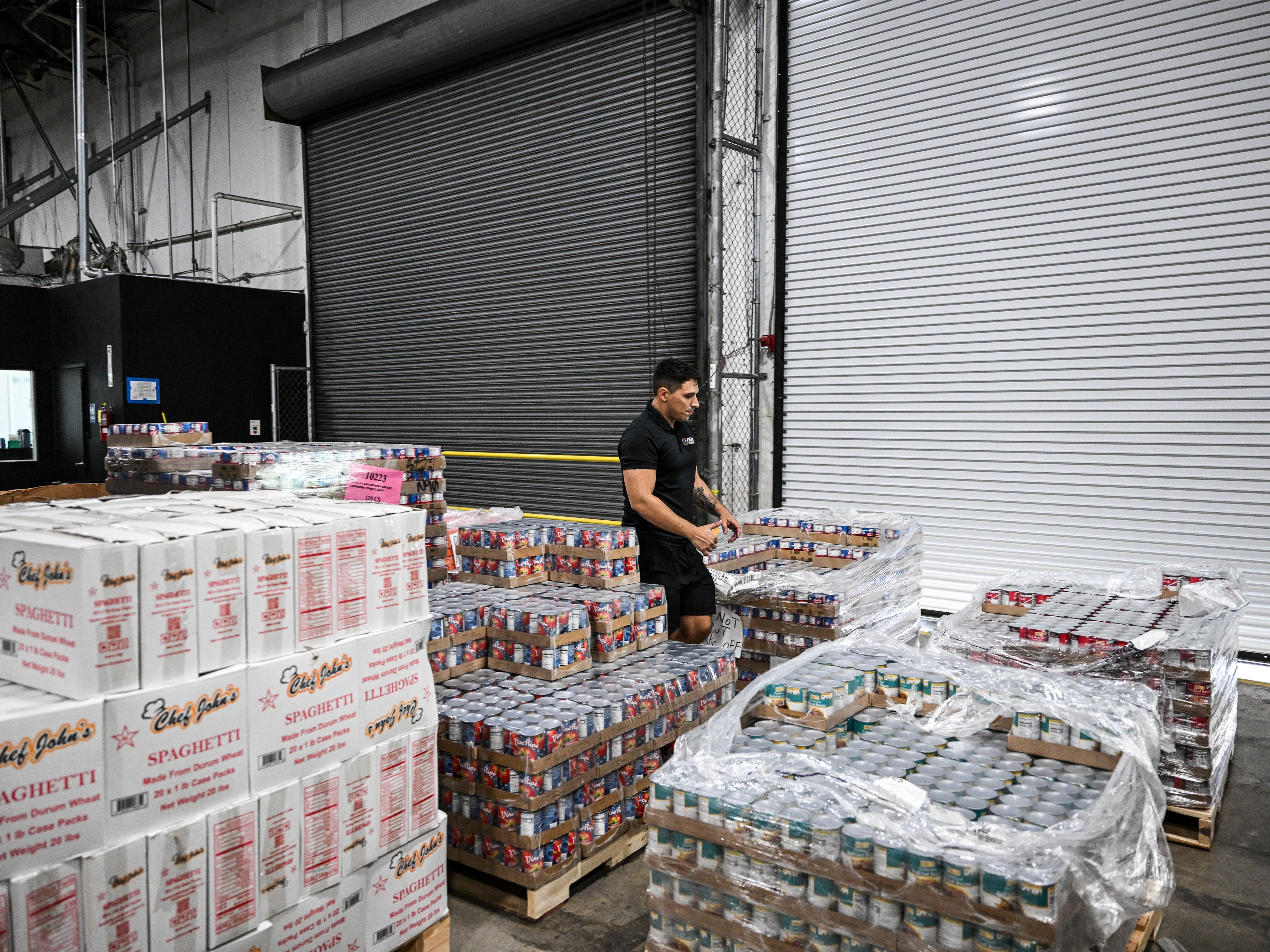 caption: Volunteers assemble relief packages for Hurricane Melissa at the Global Empowerment Mission headquarters in Miami, Fla., on October 27, 2025. The traditional role that the United States plays in disaster relief around the world will be affected by the dismantling of USAID.