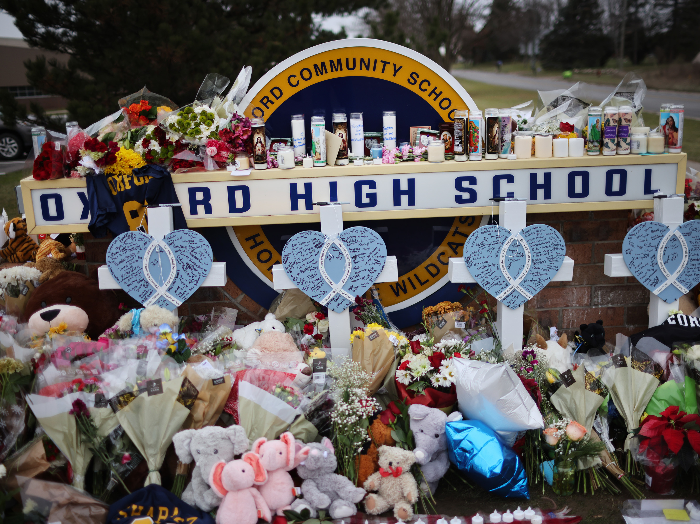 caption: A memorial has been set up outside of Oxford High School, where four students were killed in a mass shooting Tuesday.