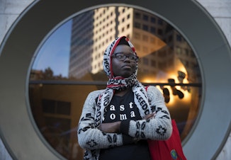 caption: Santa Anigo, 30, poses for a portrait during a rally at Westlake Park on Thursday, June 22, 2017, in Seattle, Washington. Anigo said she wants people to stand up against racism and speak out against prejudice.