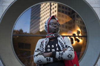 caption: Santa Anigo, 30, poses for a portrait during a rally at Westlake Park on Thursday, June 22, 2017, in Seattle, Washington. Anigo said she wants people to stand up against racism and speak out against prejudice.