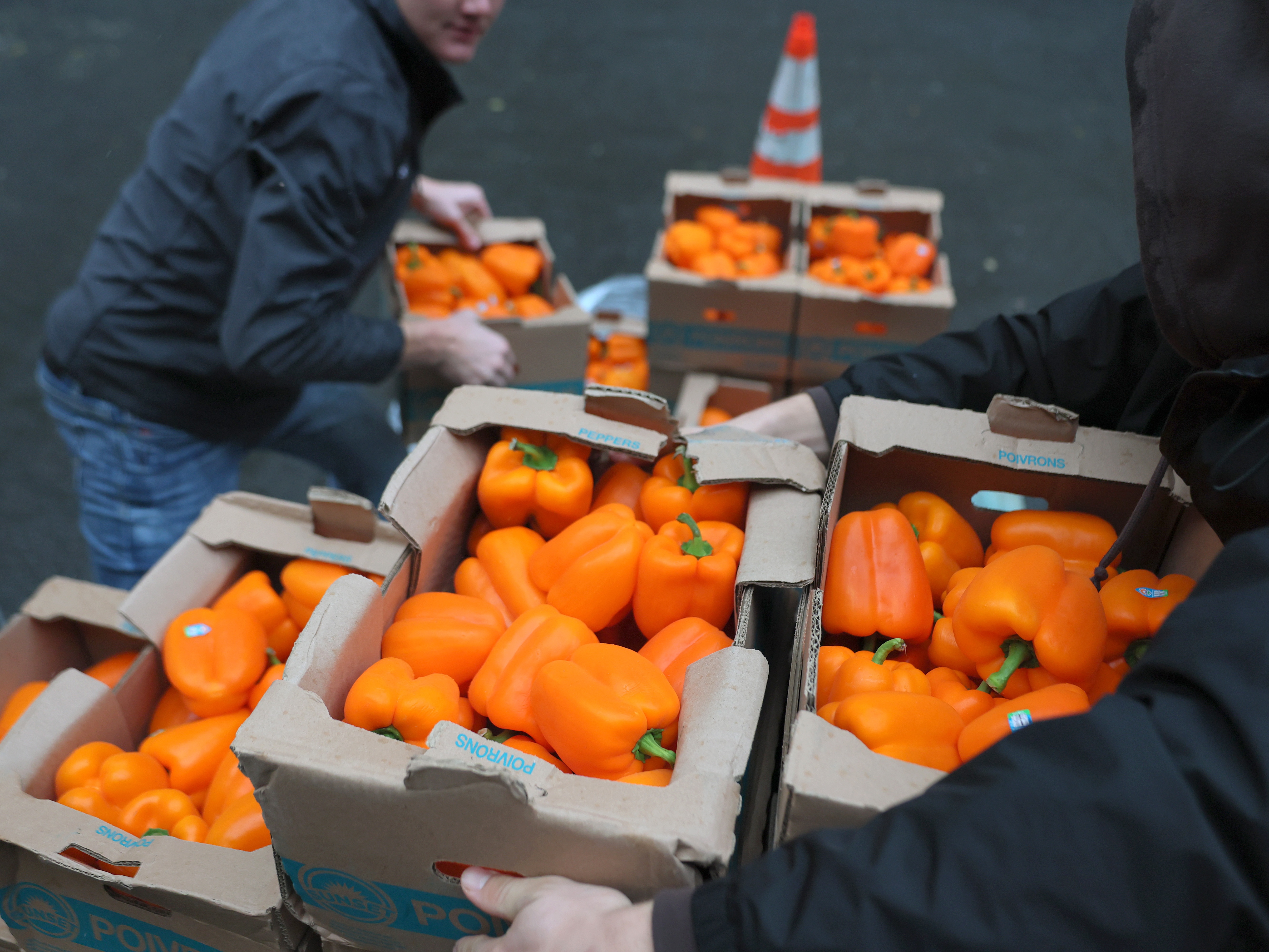 caption: Volunteers with New York Common Pantry unload food on Thursday in New York City. Gov. Kathy Hochul declared a "food emergency" in New York, allowing for extra emergency funds and personnel to be deployed as SNAP payments will be suspended nationwide starting due to the federal government shutdown. The emergency declaration will bring in an additional $65 million in emergency food funding and will allow CUNY and SUNY students to be deployed across the state to help with food distribution.