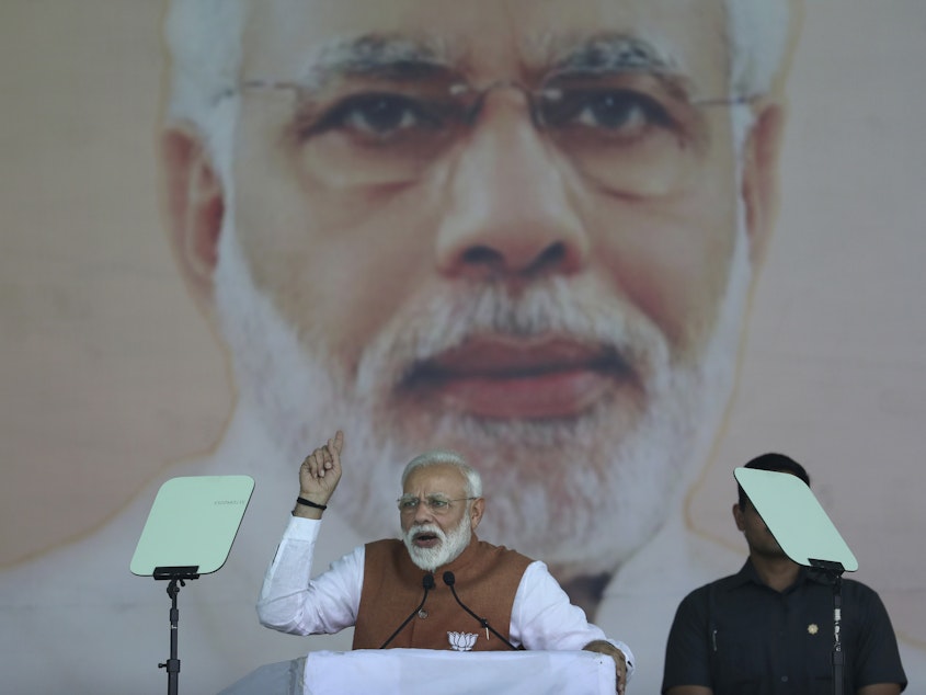 caption: In this March 28 photo, Indian Prime Minister Narendra Modi addresses a campaign rally in Meerut. One of his efforts as prime minister has been to construct millions of toilets to reduce open defecation.