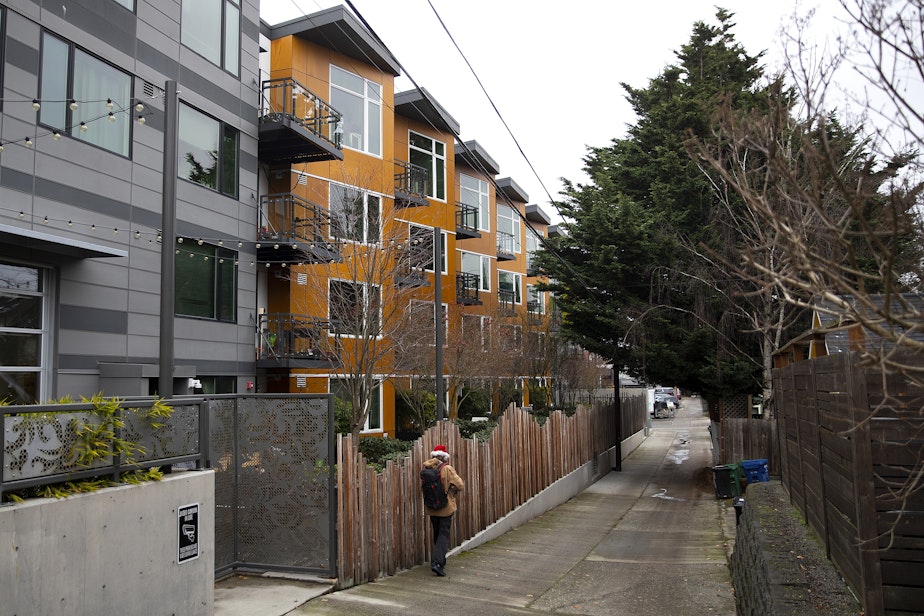 caption: The alleyway behind the Janus apartments along 85th street is shown on Monday, December 19, 2022, in Seattle. 