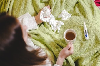 caption: Is that sneezing or coughing fit a sign of allergies, a cold, the flu or COVID-19? If you also have a fever — a temperature above 100.4 degrees Fahrenheit or higher — those symptoms probably signal infection and not just allergies acting up. (Wait 30 minutes after eating or drinking to get an accurate measurement.)