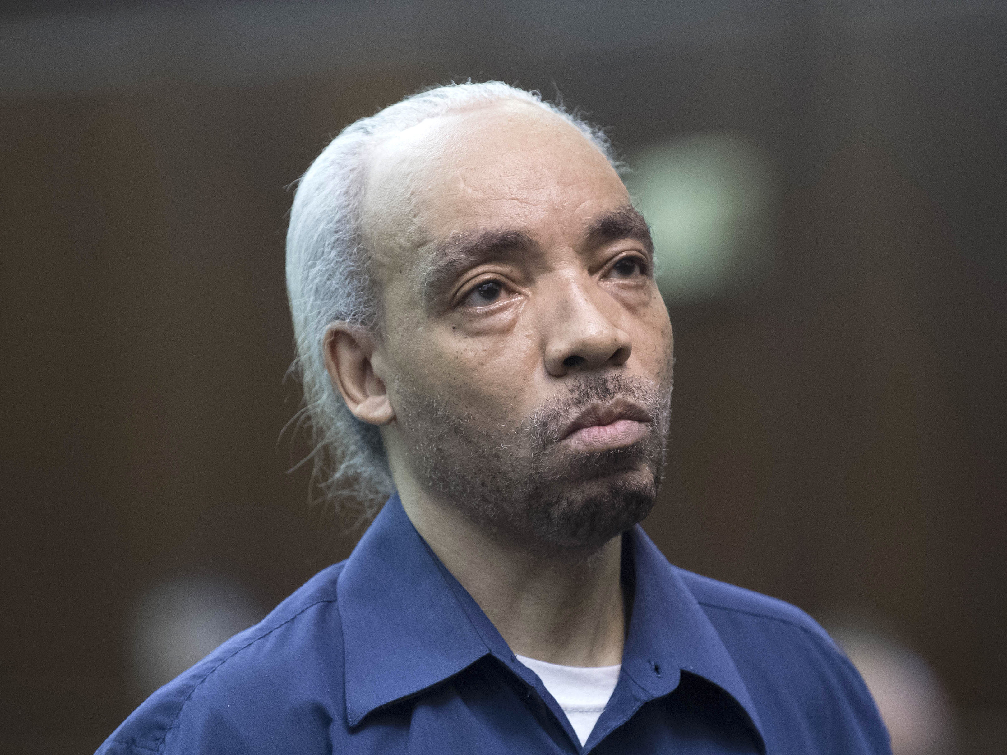 caption: Rapper Kidd Creole, whose real name is Nathaniel Glover, is arraigned in New York in 2017 after he was arrested on a murder charge.