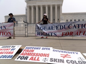 caption: People protest outside of the Supreme Court in Washington, D.C., Thursday. The Supreme Court on Thursday struck down affirmative action in college admissions, declaring race cannot be a factor and forcing institutions of higher education to look for new ways to achieve diverse student bodies.