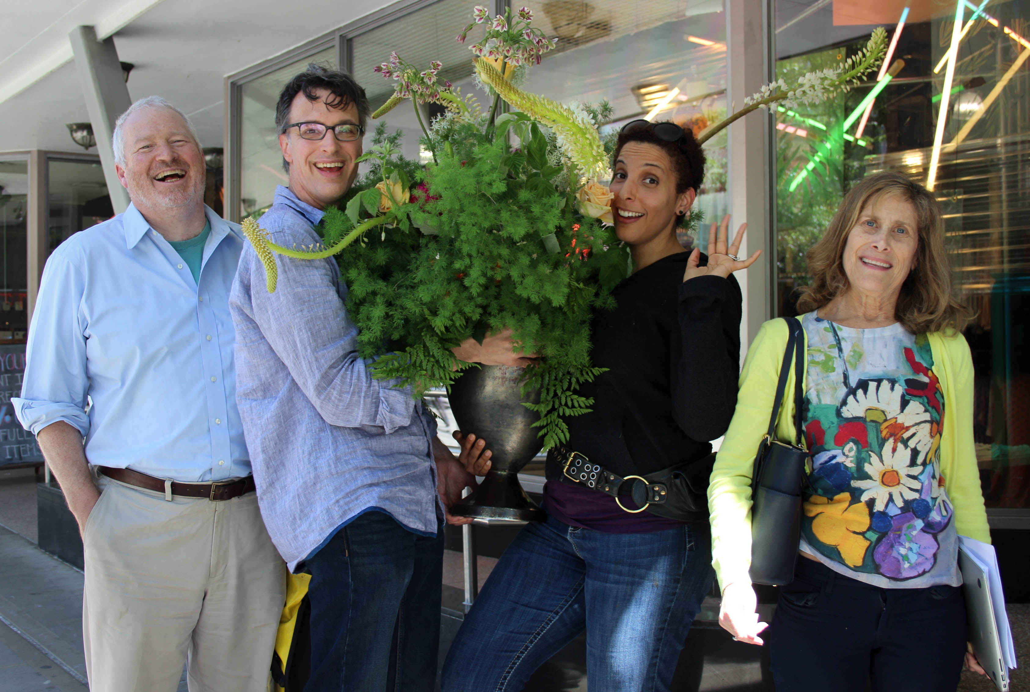 caption: Bill Radke, second from left, said he was tired of frozen smile photos. Melanie McFarland, next to him, then noticed a bananas bouquet that's been hanging in our green room. Far left, former Mayor Mike McGinn. Far right, Joni Balter. Outtakes below.
