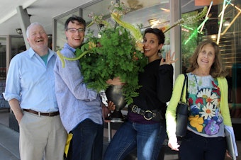 caption: Bill Radke, second from left, said he was tired of frozen smile photos. Melanie McFarland, next to him, then noticed a bananas bouquet that's been hanging in our green room. Far left, former Mayor Mike McGinn. Far right, Joni Balter. Outtakes below.