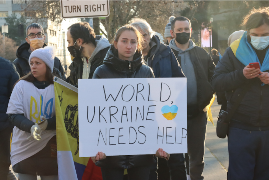 caption: A demonstration in support of Ukraine at Seattle's Space Needle on Feb. 24, 2022. 