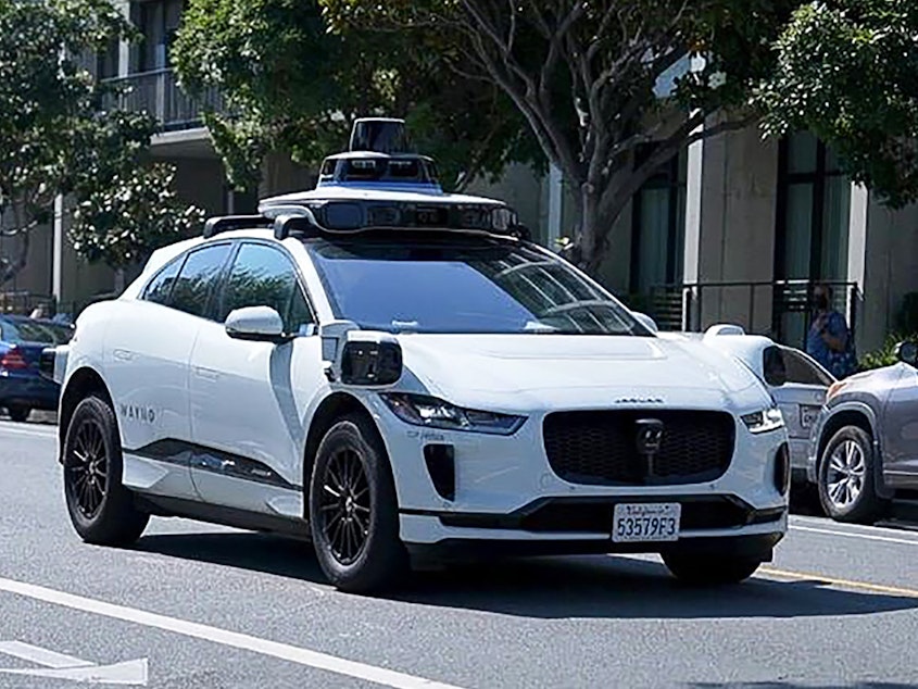 caption: A Waymo car is seen on the streets of San Francisco on Aug. 25, 2023.