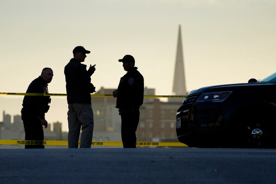 caption: Police stand at the top of the closed street outside the home of Paul Pelosi, the husband of House Speaker Nancy Pelosi, in San Francisco, Friday, Oct. 28, 2022. Paul Pelosi, was attacked and severely beaten by an assailant with a hammer who broke into their San Francisco home early Friday, according to people familiar with the investigation. In the background is the Transamerica Pyramid.