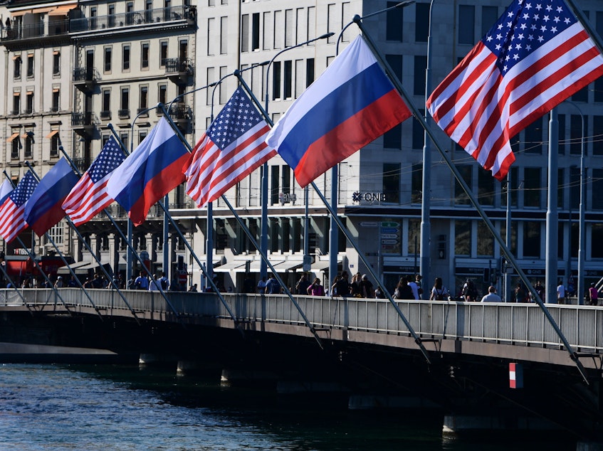 caption: U.S. and Russian flags fly on the Mont-Blanc bridge on the eve of a US-Russia summit on Tuesday in Geneva. A former intelligence operative says agencies are in high gear.