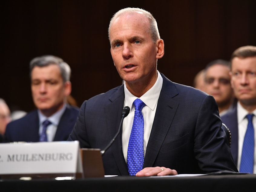 caption: Boeing CEO Dennis Muilenburg testifies before a Senate committee last week on the 737 Max plane crashes. A lawmaker asked him if he was taking a cut in pay, prompting the CEO to give up his bonuses.