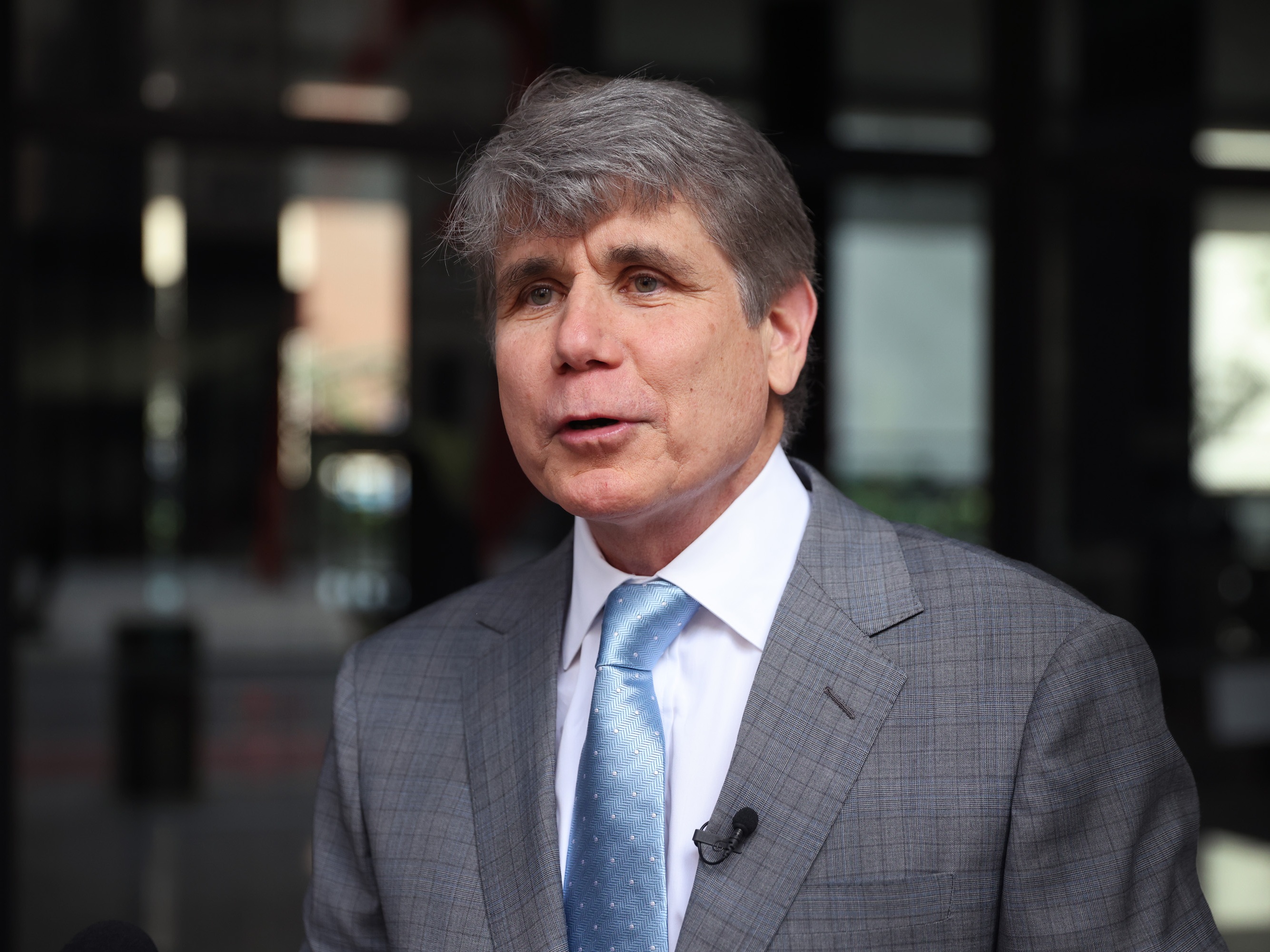caption: Former Illinois Gov. and convicted felon Rod Blagojevich speaks to the press outside of the Dirksen Federal Courthouse in August 2021 in Chicago.