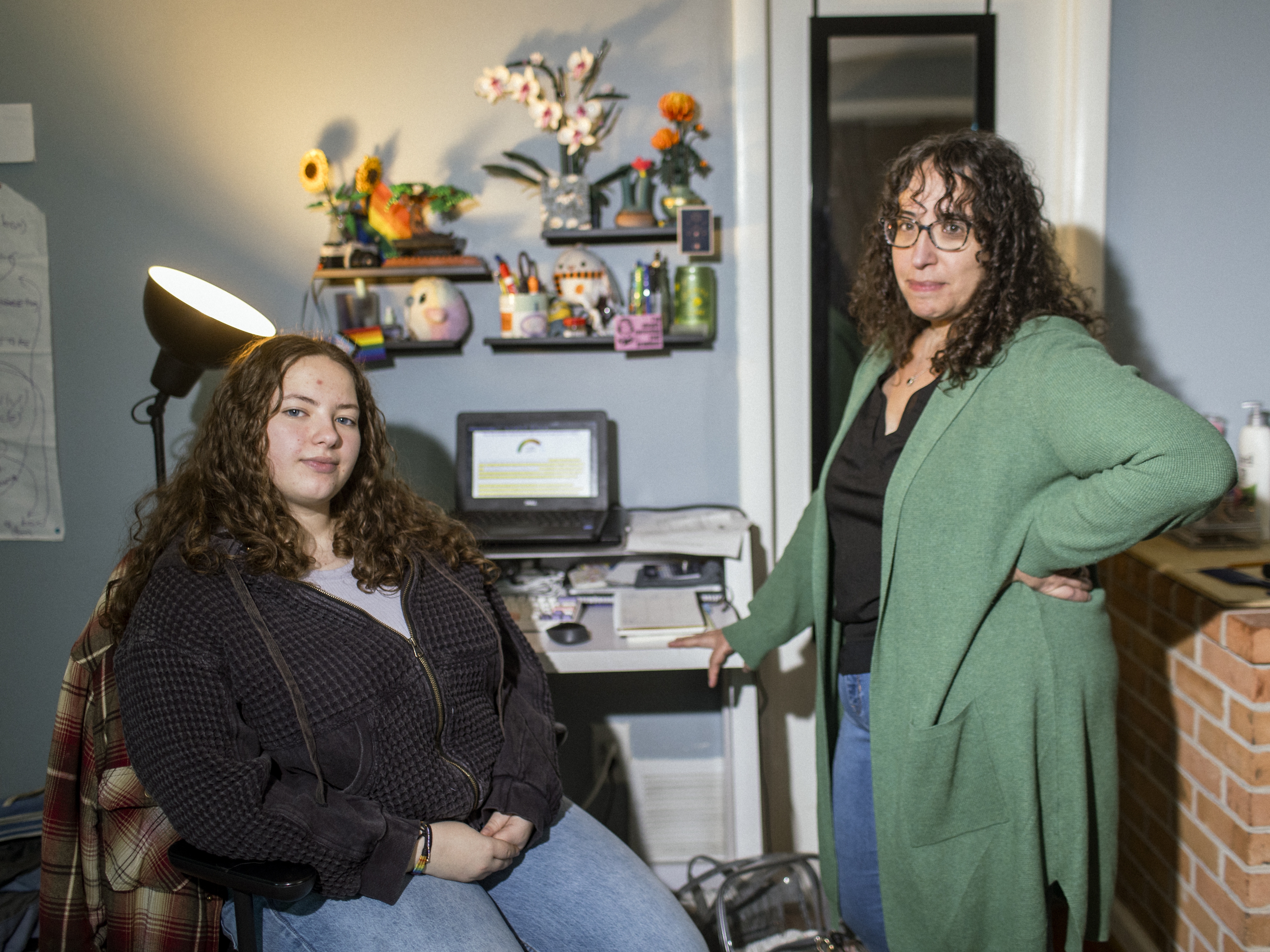 caption: Ailsa Ostovitz, left, and her mother, Stephanie Rizk, at their home in the Maryland suburbs of Washington, D.C. In mid-November, Rizk met with Ostovitz's teachers to discuss accusations that her daughter had used AI to do some of her schoolwork.