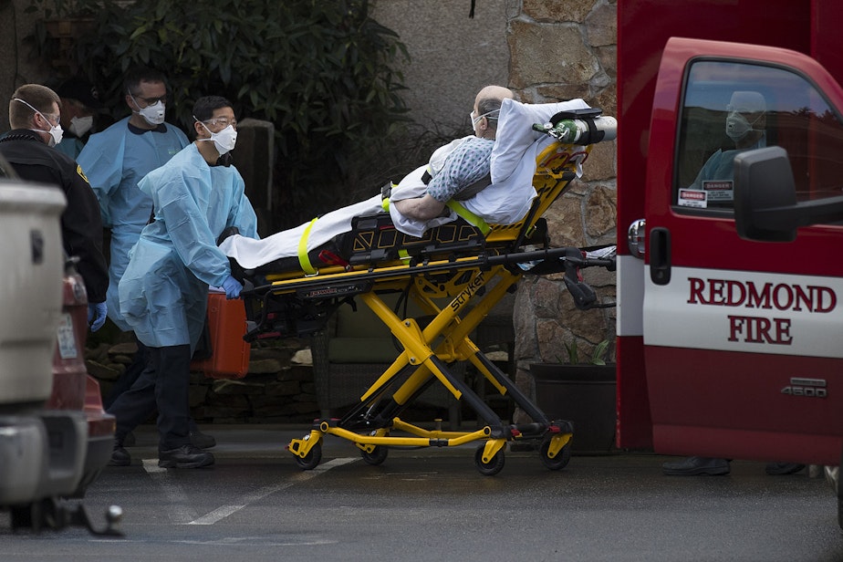 caption: An unidentified patient is transported into an ambulance from the Life Care Center of Kirkland, the long-term care facility at the epicenter of the coronavirus outbreak in Washington state, on Tuesday, March 3, 2020, in Kirkland. It is unclear if the patient is suspected of having coronavirus.