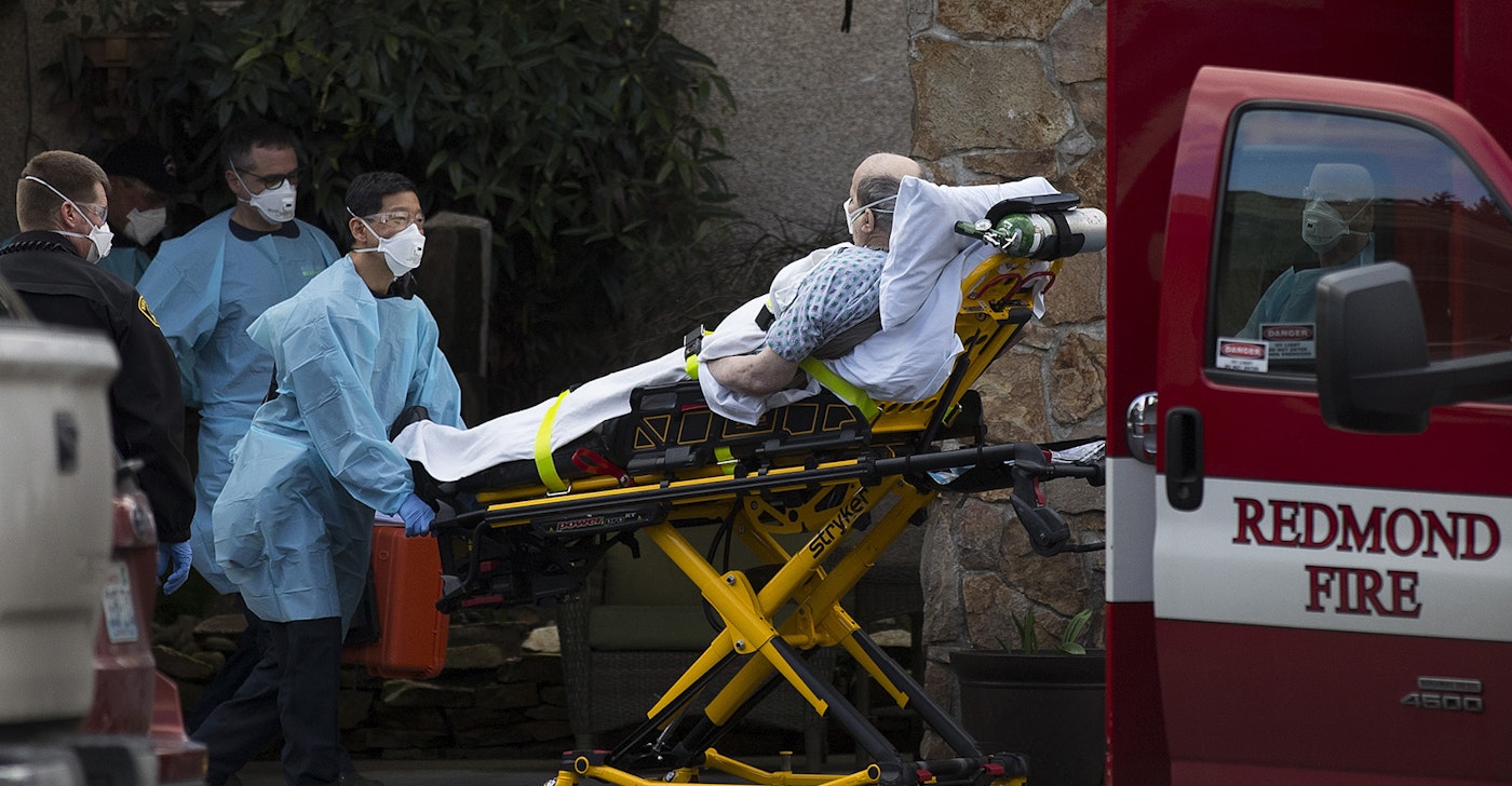caption: An unidentified patient is transported into an ambulance from the Life Care Center of Kirkland, the long-term care facility at the epicenter of the coronavirus outbreak in Washington state, on Tuesday, March 3, 2020, in Kirkland. It is unclear if the patient is suspected of having coronavirus.