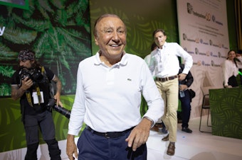 caption: Colombian presidential candidate Rodolfo Hernández receives a warm welcome at the National Congress of Oil Palm Growers in Bucaramanga, Colombia, on June 3.