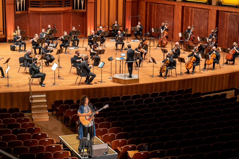 caption: In the first Seattle Symphony performance since the quarantine, musicians were distanced and guest artist Whitney Mongé performed from a separate platform. 