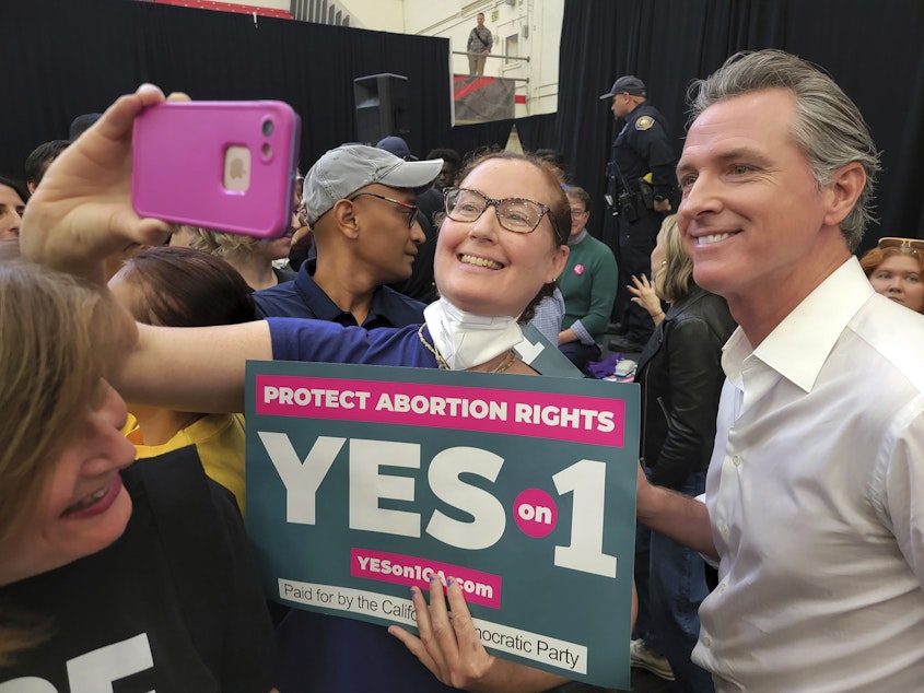 caption: In a file photo from Nov. 6, 2022, California Gov. Gavin Newsom appears at a rally in support of Proposition 1, a state constitutional amendment to guarantee the right to abortion and contraception.