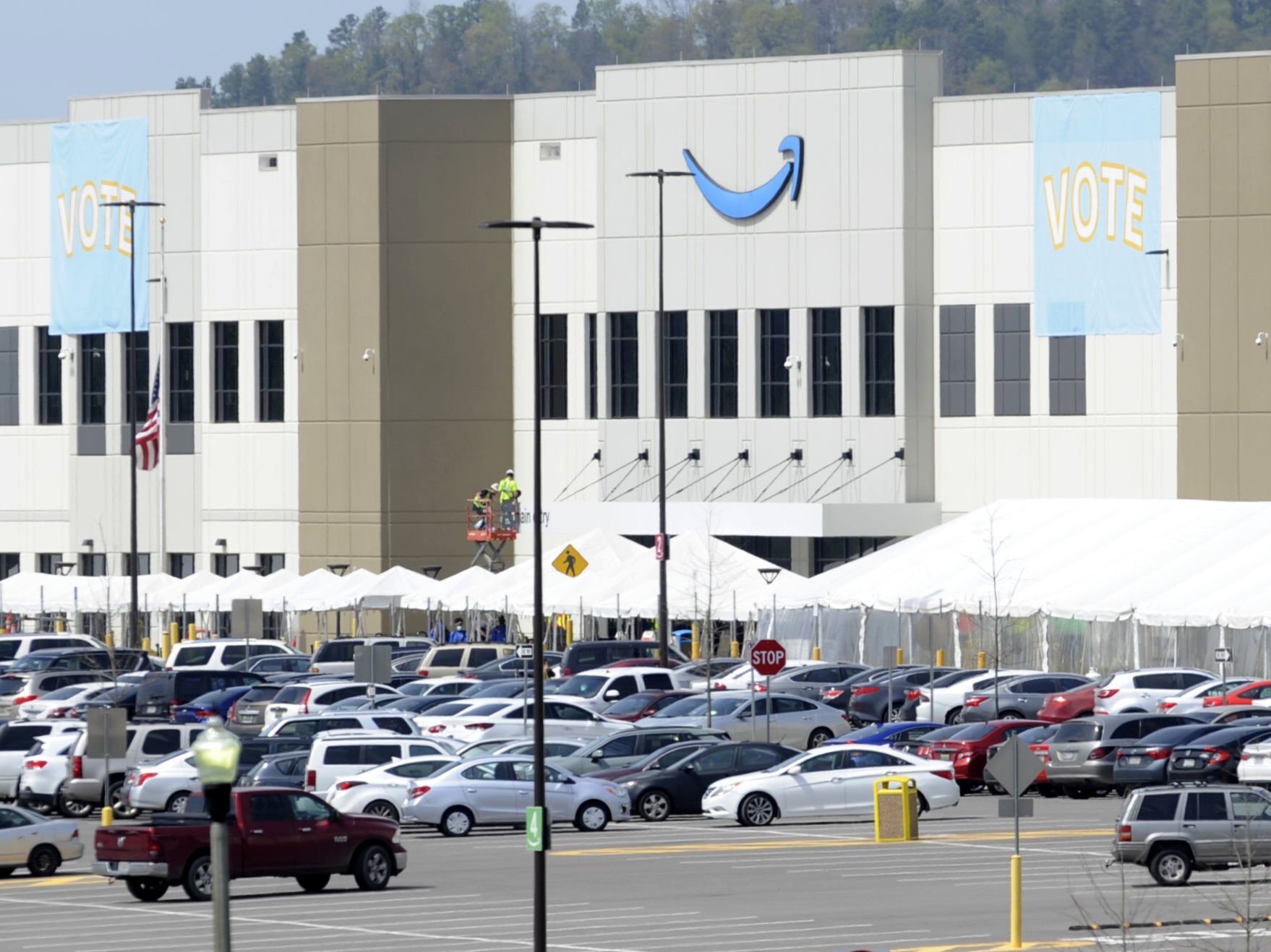 caption: Vote tally is underway in a historic union election at Amazon's warehouse in Alabama.