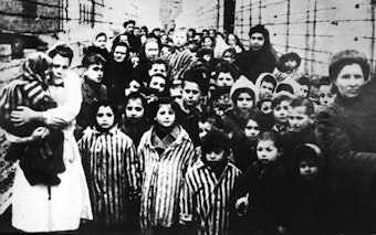 caption: Surviving children of the Auschwitz concentration camp, one of the camps the Nazis had set up to exterminate Jews and kill millions of others. Research into the appropriate way to "re-feed" those who've experienced starvation was prompted by the deaths of camp survivors after liberation.