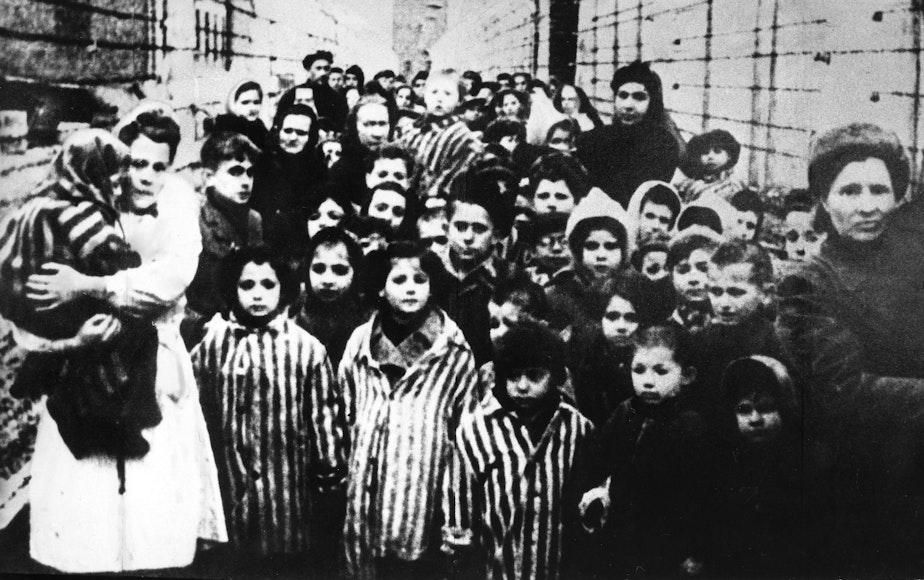 caption: Surviving children of the Auschwitz concentration camp, one of the camps the Nazis had set up to exterminate Jews and kill millions of others. Research into the appropriate way to "re-feed" those who've experienced starvation was prompted by the deaths of camp survivors after liberation.
