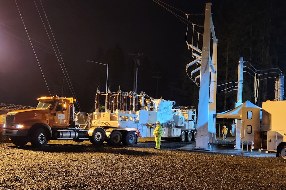 caption: Tacoma Public Utilities crews bring a mobile substation to handle electricity at a Graham, Washington, substation damaged early Christmas morning. Dec. 26 photo.