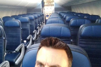 caption: Peace Corps volunteer Adam Greenberg worked to develop fish farming in Zambia. He took this selfie on March 23, en route to San Diego, the final destination of his evacuation.
