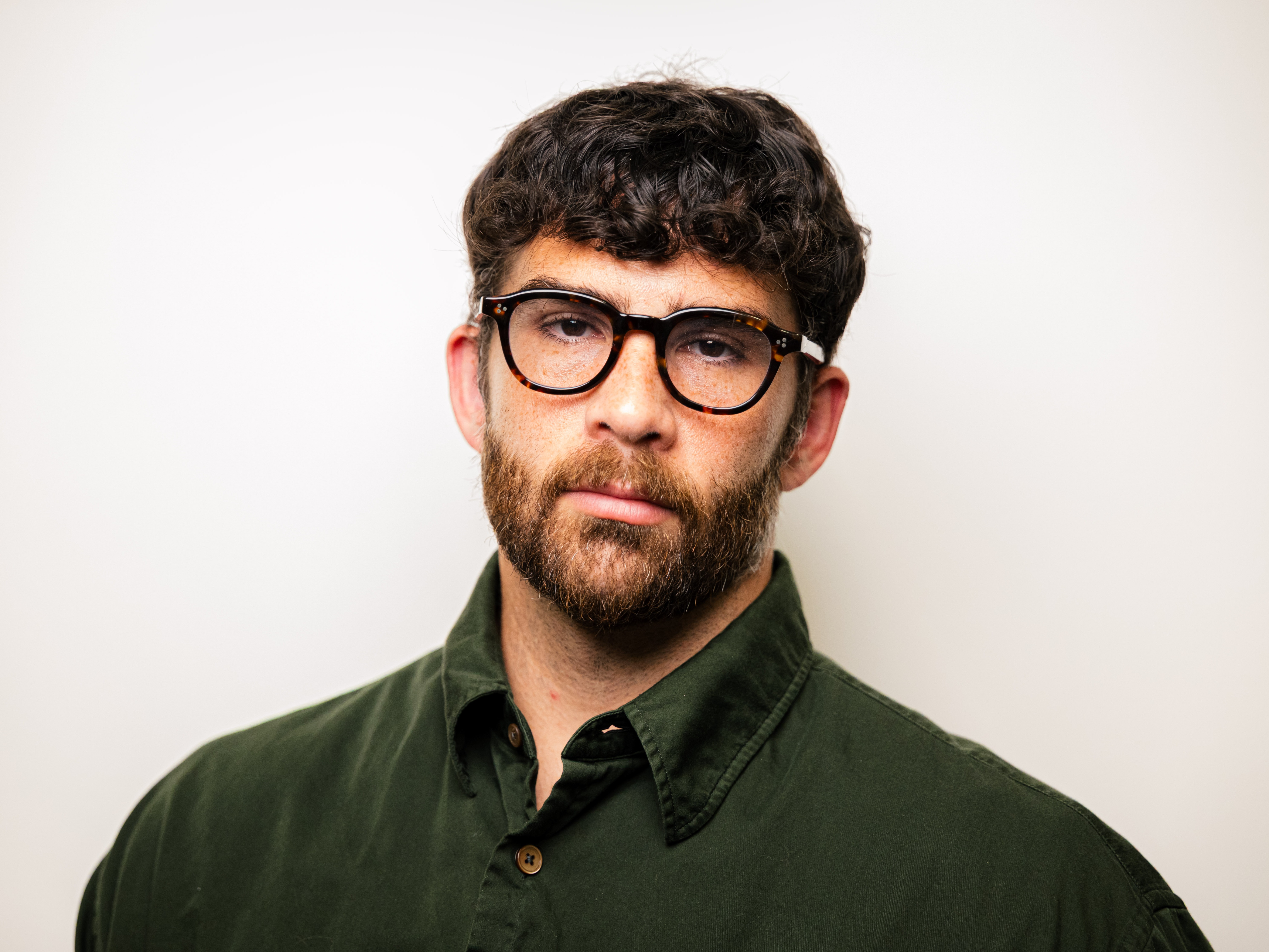 caption: Hasan Piker, Twitch streamer and political commentator, poses at NPR's Culver City studios