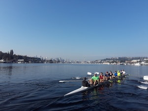 caption: Rowers from the Pocock Rowing Center on the lake one Saturday morning recently. 