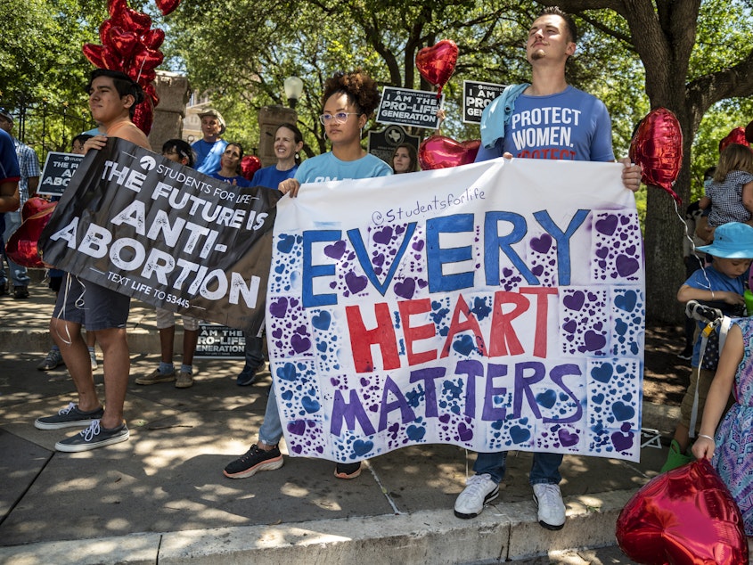 caption: Anti-abortion-rights protesters come out in May to the Texas Capitol in Austin in response to a bill that Gov. Greg Abbott signed outlawing abortions after a fetal heartbeat is detected.