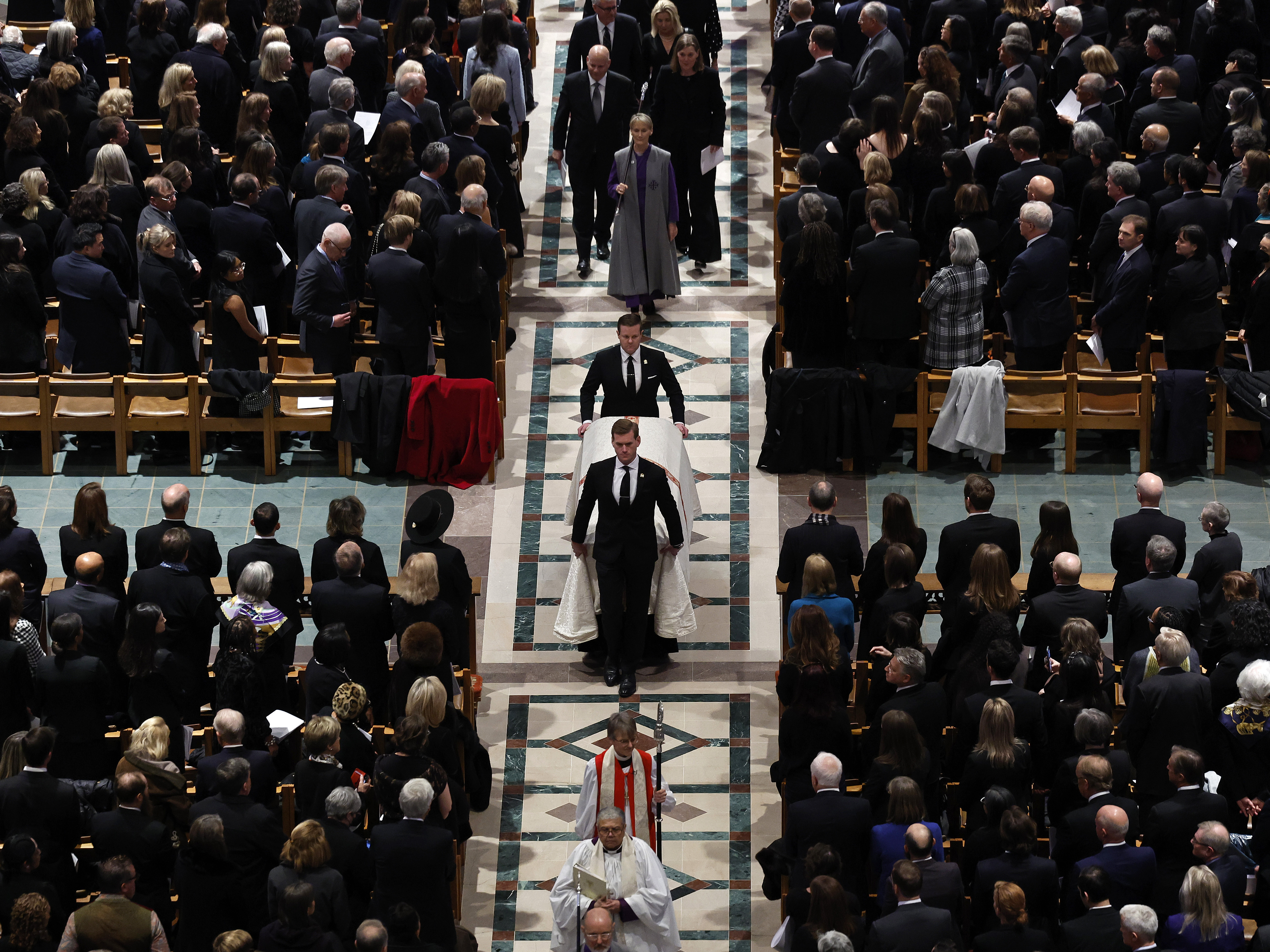 caption: Supreme Court Justice Sandra Day O'Connor's casket is wheeled out of Washington National Cathedral at the conclusion of her funeral.