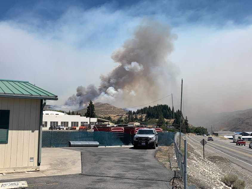 caption: The Red Apple fire burns near Wenatchee on July 14, 2021.