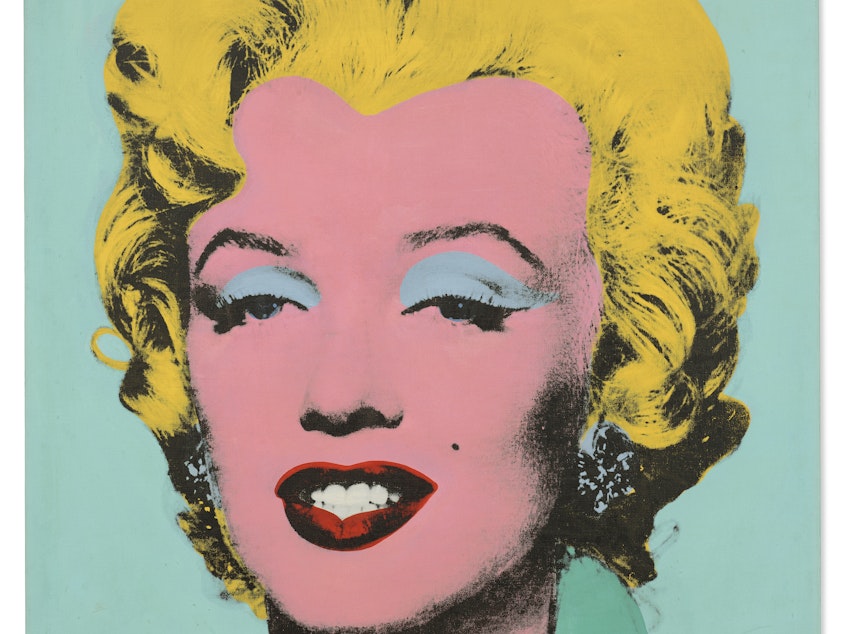 caption: Andy Warhol's <em>Shot Sage Blue Marilyn</em> has set a record as the highest-priced American work of art to be sold at auction.