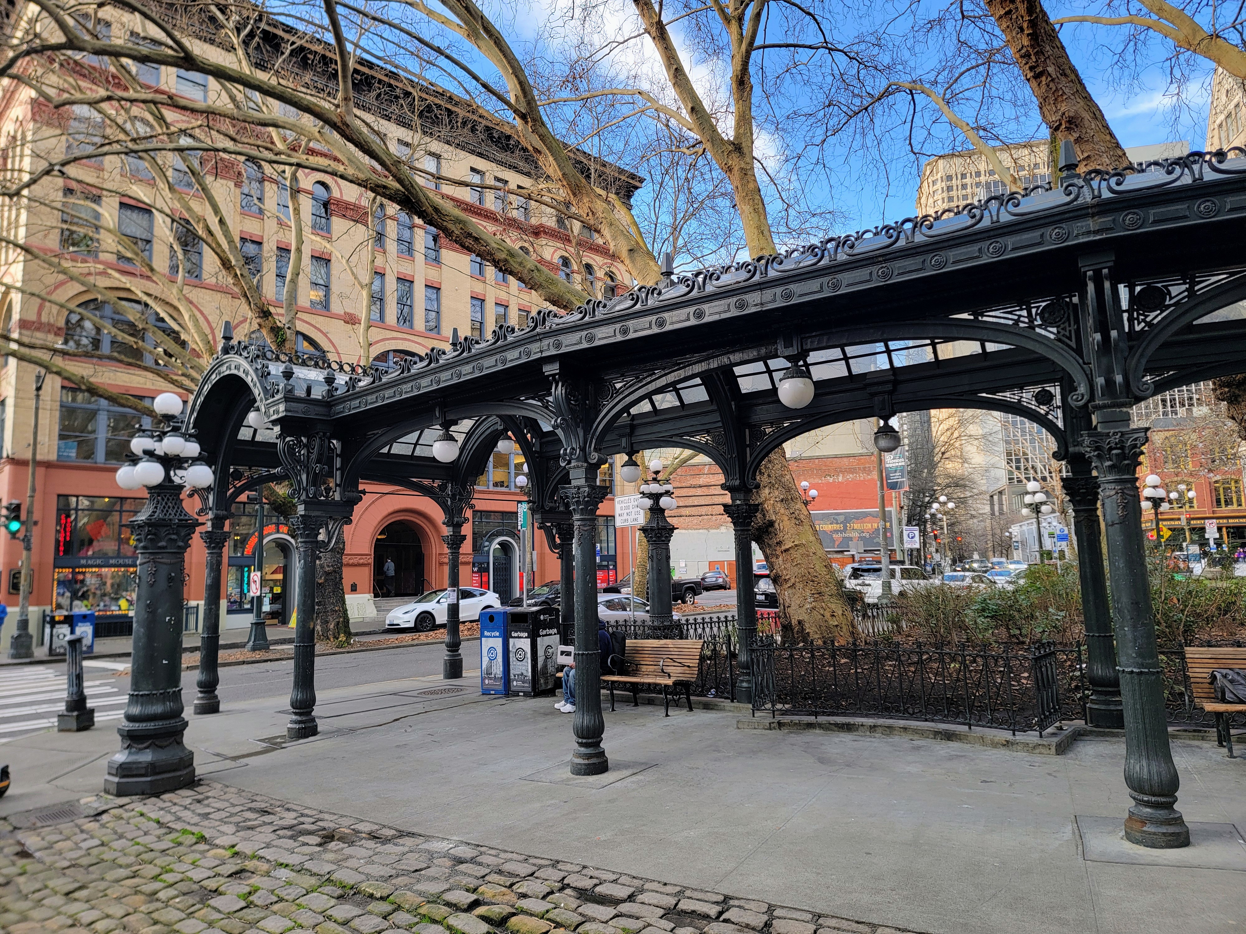 caption: Built in 1909, the Pioneer Square Pergola is a well-known landmark in the heart of the city's oldest neighborhood.