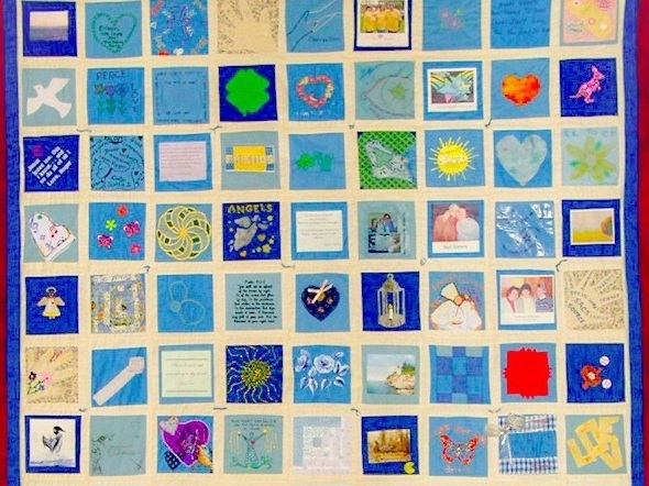 caption: Richard Beebe cherishes this quilt in memory of his wife, Eileen.