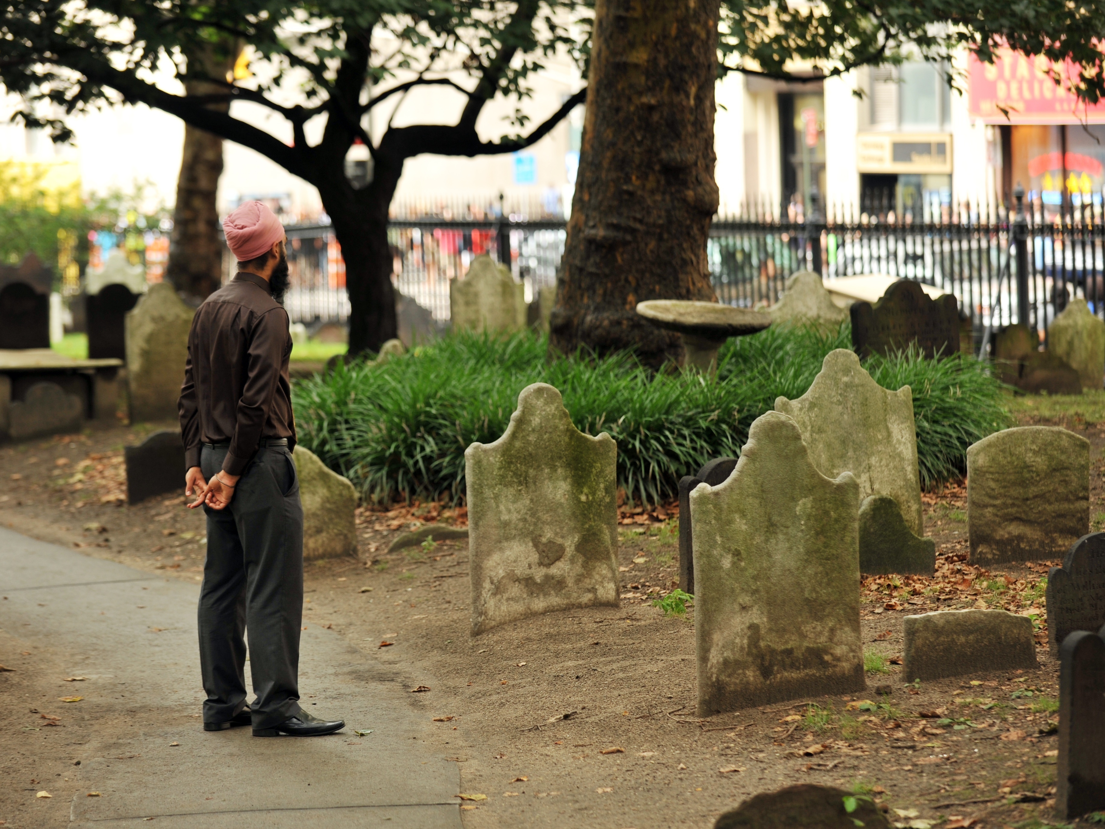 caption: Simran Jeet Singh, pictured here in the days after the attack on the Sikh temple in Oak Creek, Wis. in 2012, says he turned to his faith to help him through.