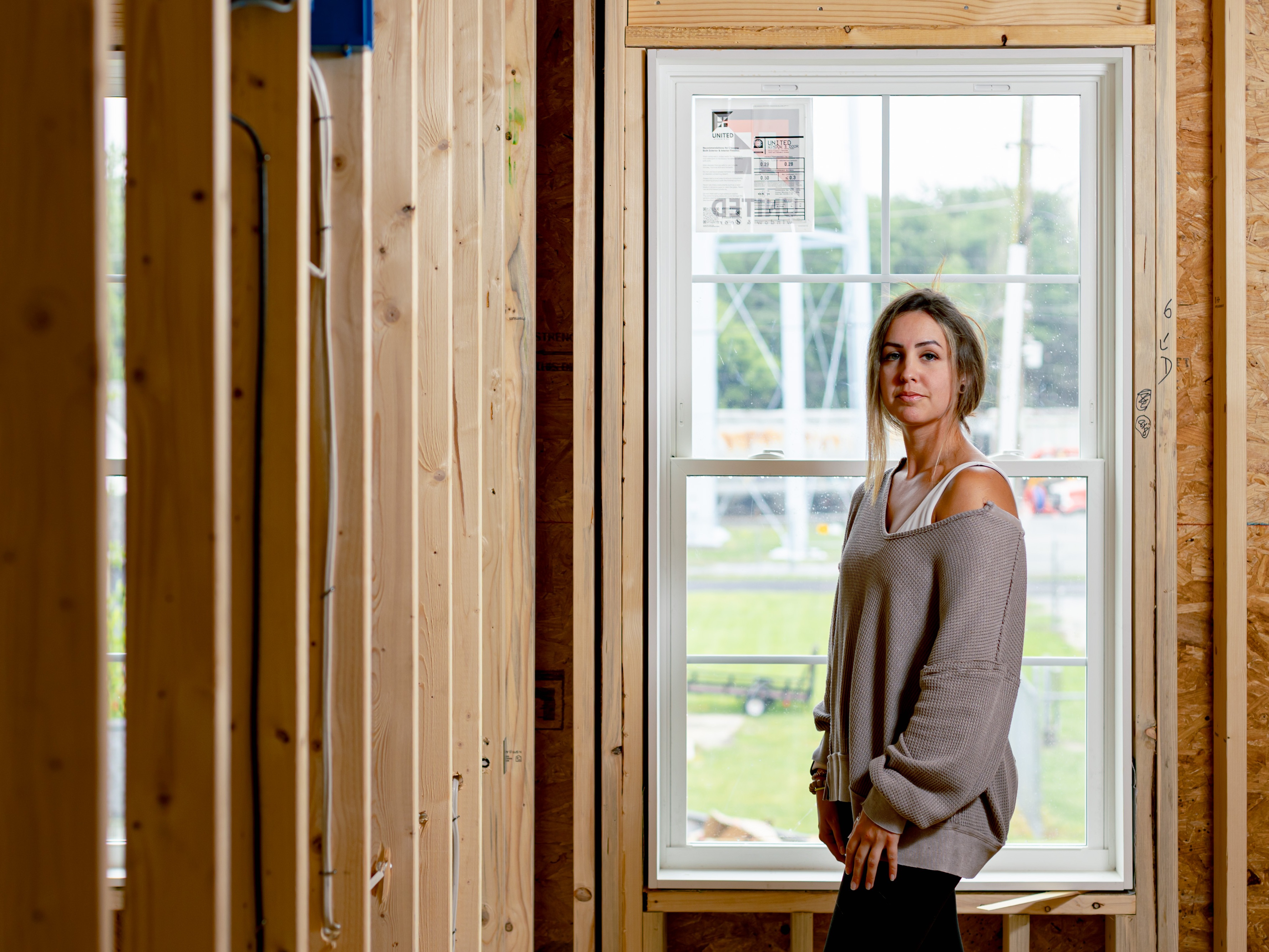 caption: Becca Morris in the home she's in the process of buying in Harrington, Delaware, on May 14, 2026. She found it just a few months before her federal housing subsidy was set to end.