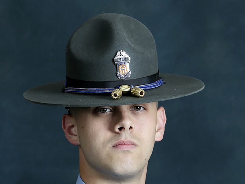 caption: Former state Trooper Jacob Gordon Thompson has been charged with felony murder and aggravated assault in the killing of Julian Edward Roosevelt Lewis, a 60-year-old Black man.