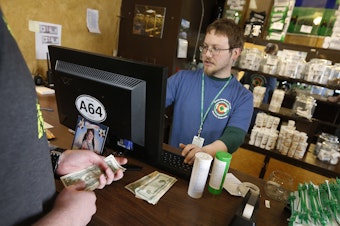 caption: A bipartisan group of attorneys general is urging Congress to pass legislation that would make it easier for banks to handle money involved in the legal cannabis industry.
