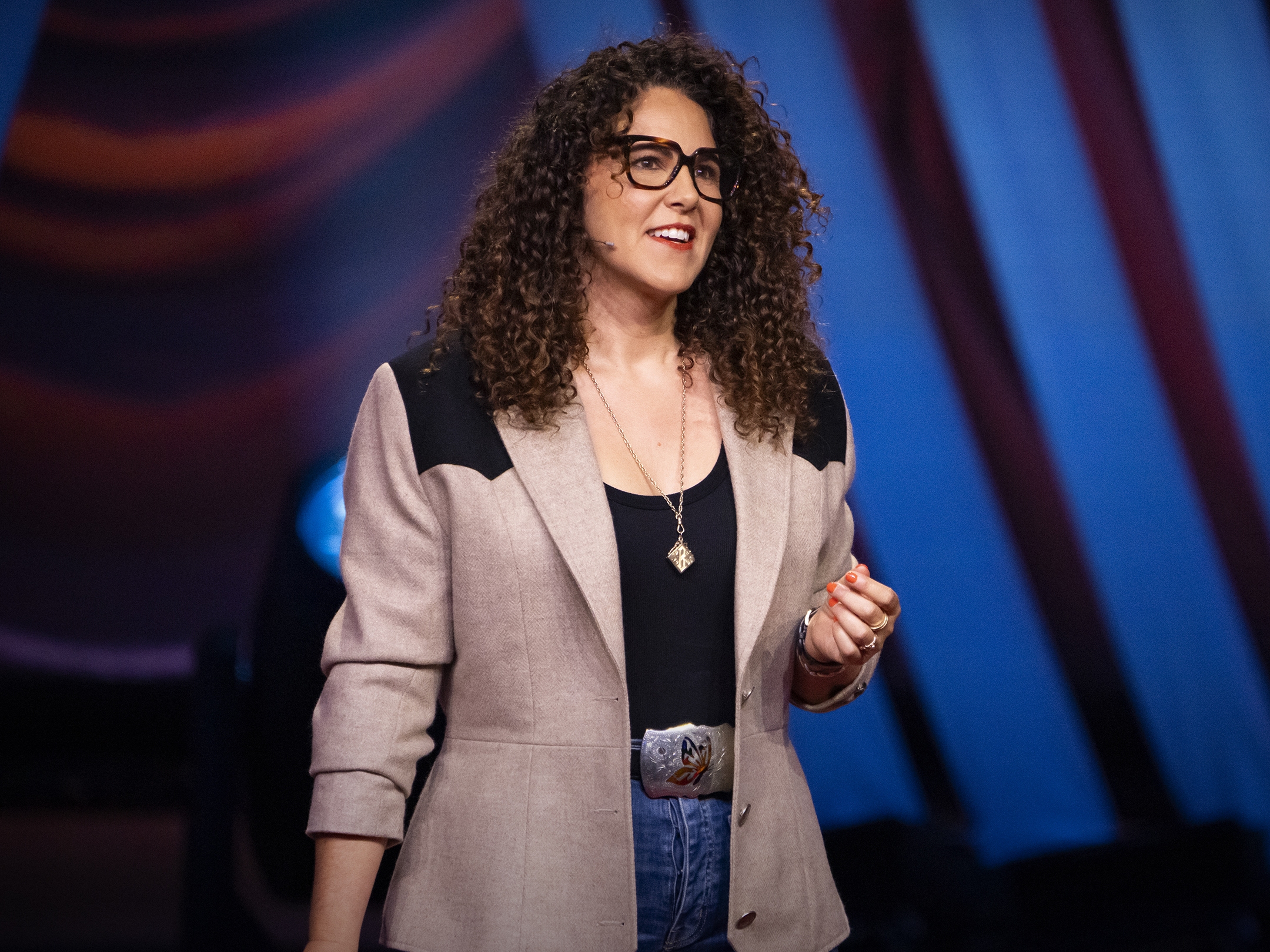 caption: Laurel Braitman speaks at TEDWomen 2023