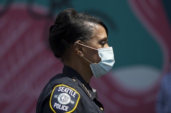 caption: Seattle Police Chief Carmen Best attends a vigil to recognize the senseless killing of African American men and women outside of the First African Methodist Episcopal Church on Monday, June 1, 2020, in Seattle.